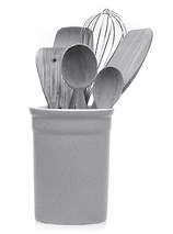 Wooden utensils for cooking are in a white glass  Kitchen spoons, scoops, forks isolated on white background  Scandinavian style in the interior of the kitchen 