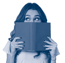 Portrait of a pretty young girl hiding behind an open book and looking away isolated over gray wall background