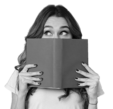 Portrait of a pretty young girl hiding behind an open book and looking away isolated over gray wall background